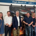 Congressman-Brandon-Williams-third-from-left-poses-with-Eagle-Metalcraft-owner-Michael-Bower-second-from-left-and-success-team-members-Justyna-left-Jim-Erin-and-Cindy