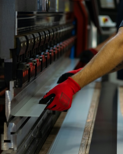 metal fabrication worker on the machine