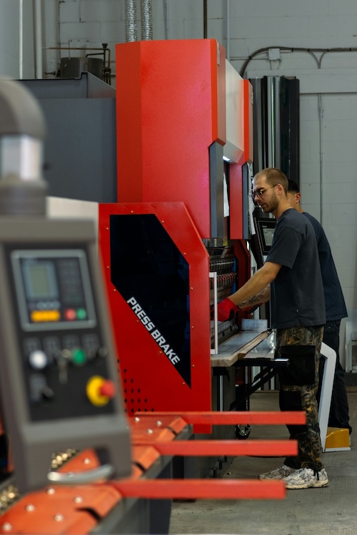 press brake operator working on project