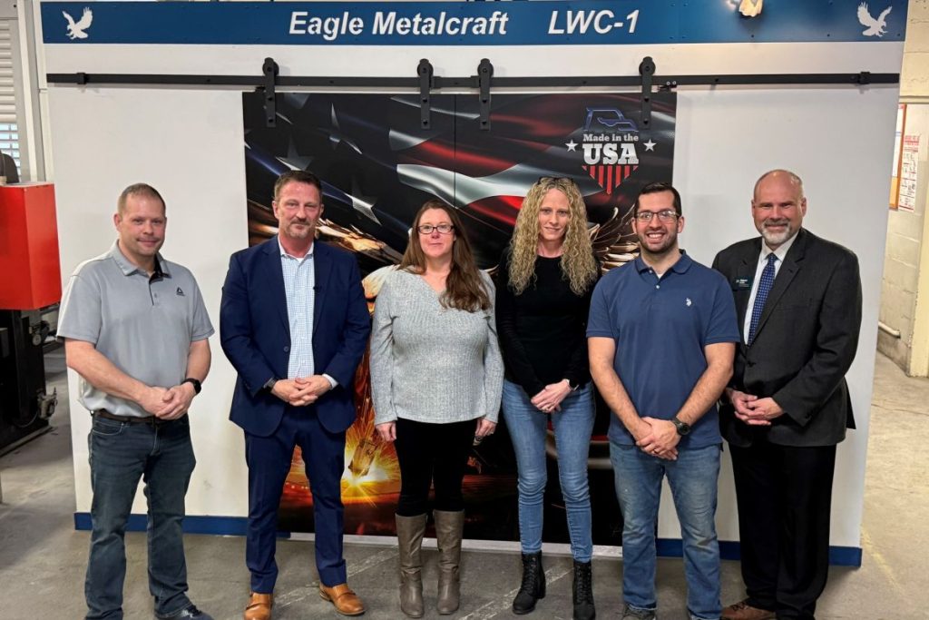 Eagle Metalcraft team members, including President & CEO Michael Bower (second from left), stand with Robert Griffin (right), CEPA, Regional Director of the North Central SBDC, during the launch of the Strategic Growth Services pilot program. The event brought together regional leaders to support second-stage manufacturers navigating growth and scaling in Central New York.